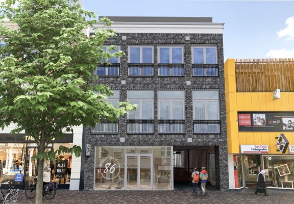 vooraanzicht Winkelpand in een winkelstraat